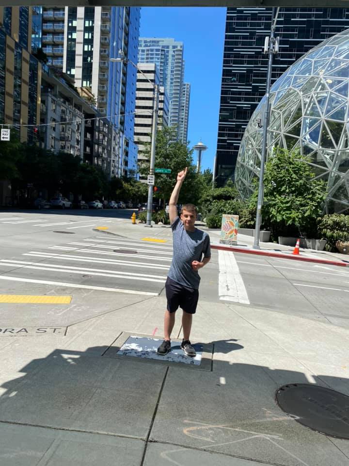 Picture of me pointing at the Space Needle in Seattle.